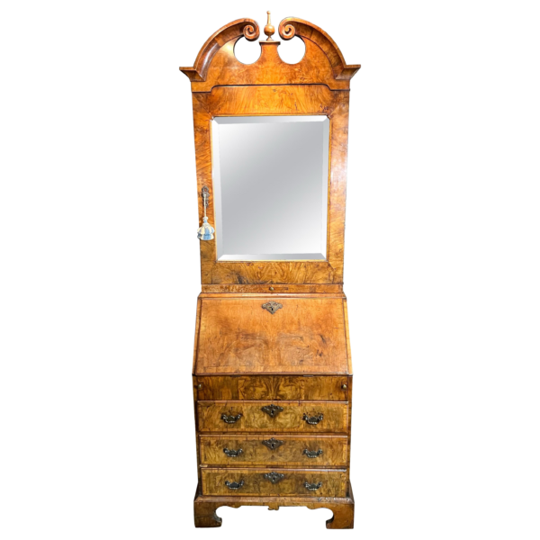 A rare small early-18th century walnut bureau bookcase/ cabinet