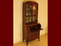 An example of a secretaire is this antique mahogany bookcase.