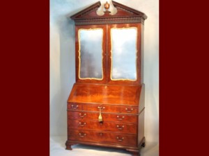 English bureau cabinet/bookcase/secretary in mahogany and parcel gilt, and in the Chippendale manner