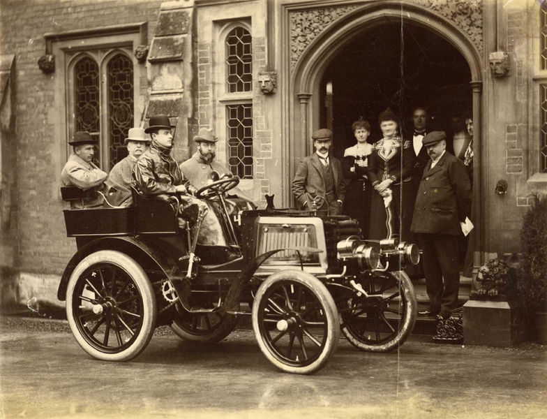 "Photograph of the Hon. C.S. Rolls' autocar with HRH The Duke of York, Lord Llangattock [Rolls' father], Sir Charles Cust and the Hon. C.S. Rolls as occupants", taken by John Howard Preston. Charles Stewart Rolls went on to co-found Rolls-Royce in 1904. The photograph shows 'The Hendre', the family's gothic mansion in Monmouthshire. 1 January 1900