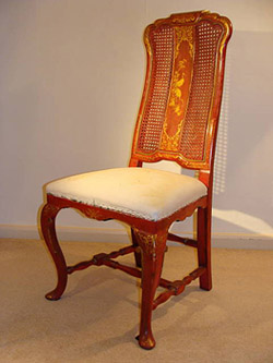 One of a set of six red lacquer chairs from the Box House Antiques Collection