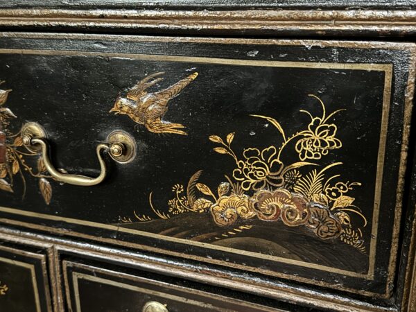 A rare Queen Anne chinoiserie japanned chest on stand drawer