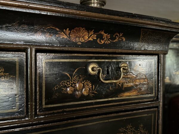 A rare Queen Anne chinoiserie japanned chest on stand top drawer