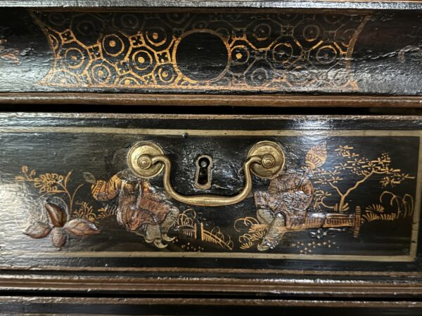 A rare Queen Anne chinoiserie japanned chest on stand middle drawer