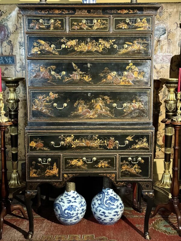 A rare Queen Anne chinoiserie japanned chest on stand