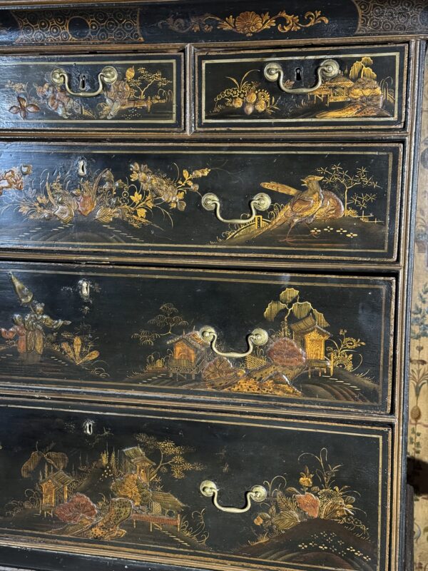 A rare Queen Anne chinoiserie japanned chest on stand side